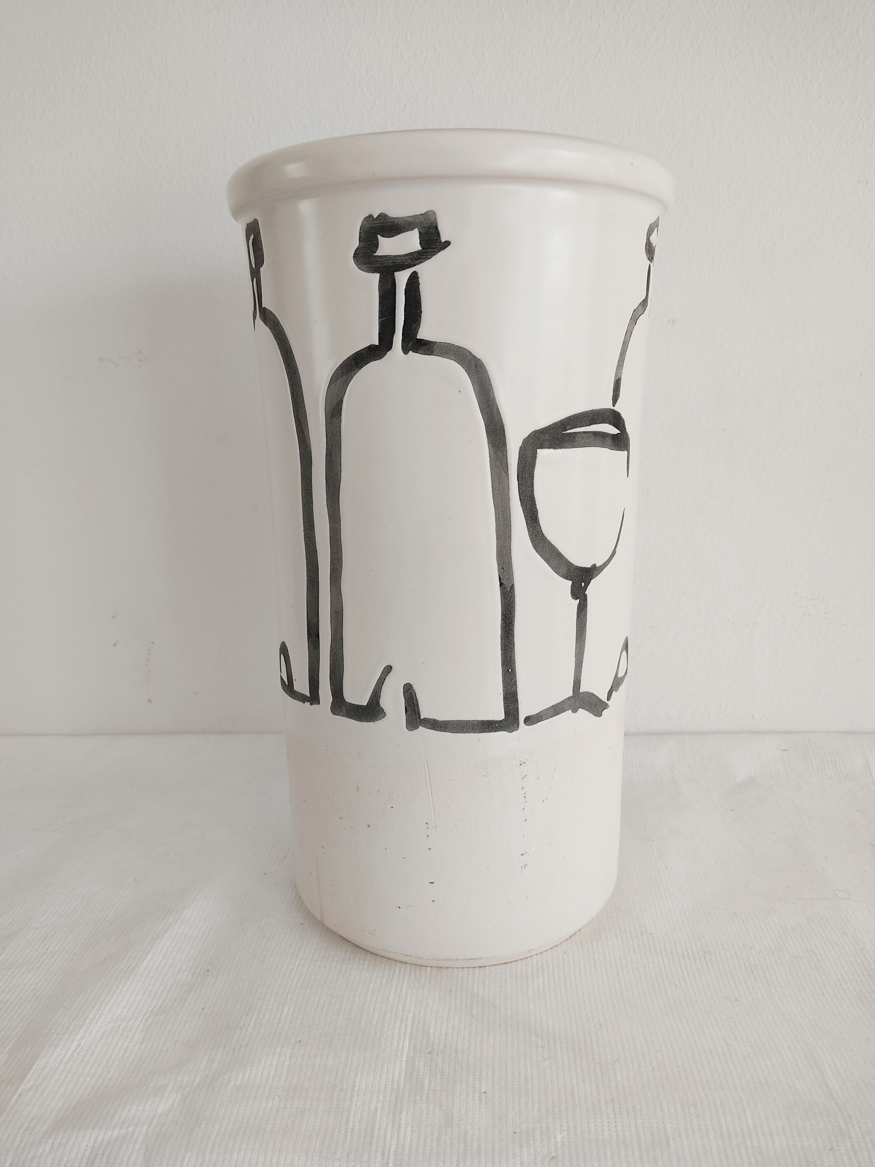 Vase decorated in hollows of bottles and glasses