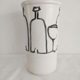 Vase decorated in hollows of bottles and glasses