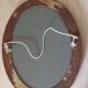 Modern oval mirror with flower decoration