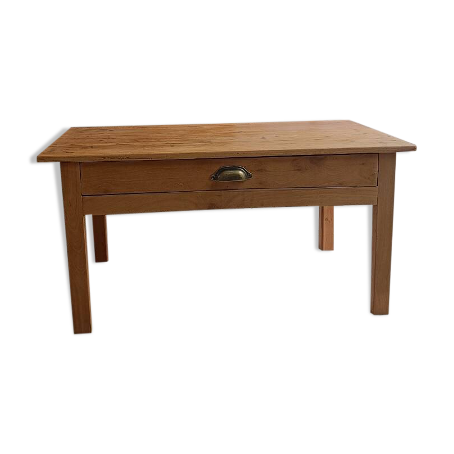 Coffee table with raw wood and a large drawer.