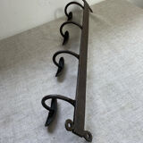 Coat rack, four hooks, in wrought iron.