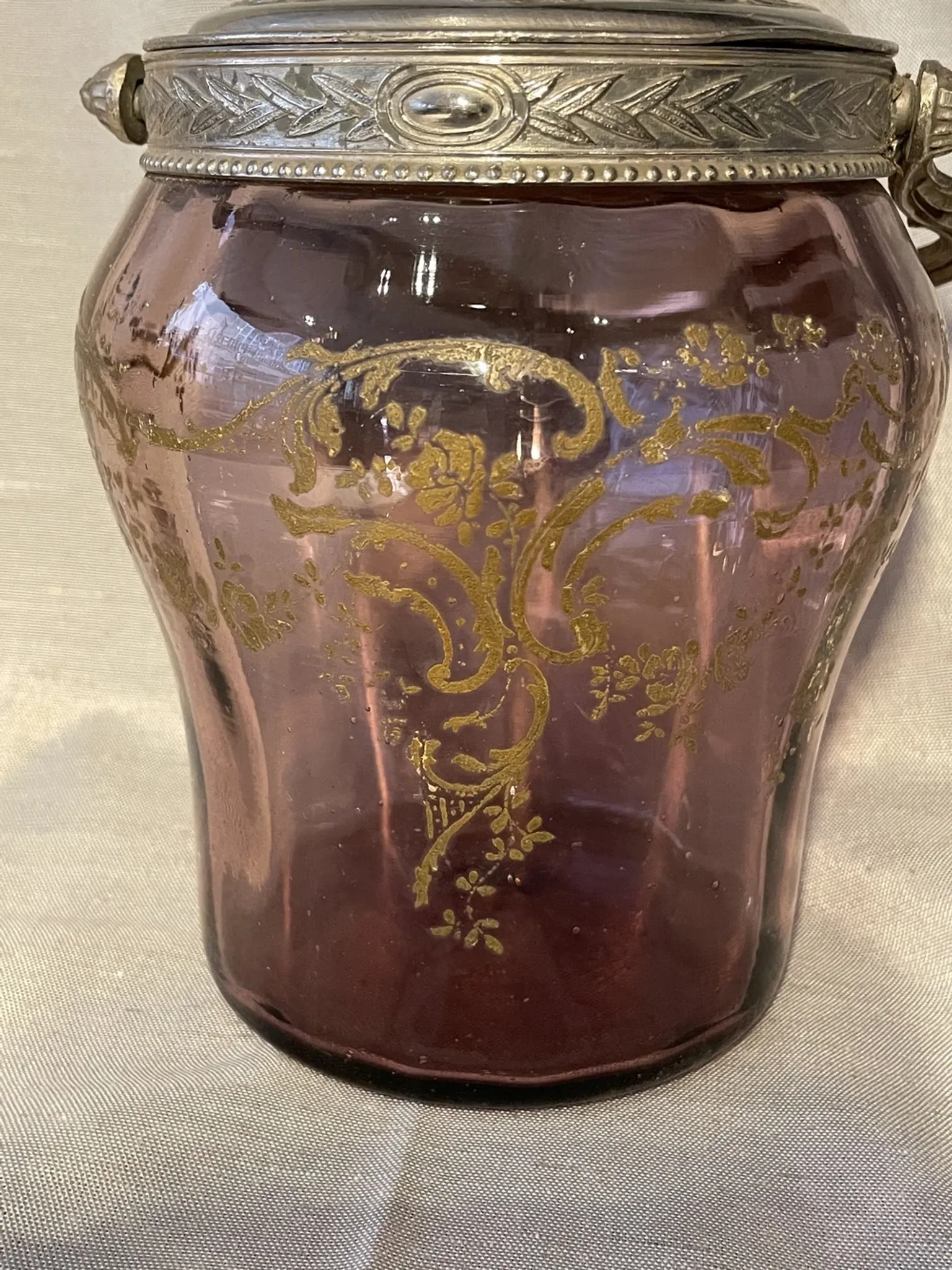 Purple glass biscuit barrel with painted gold arabesque decorations for cakes.