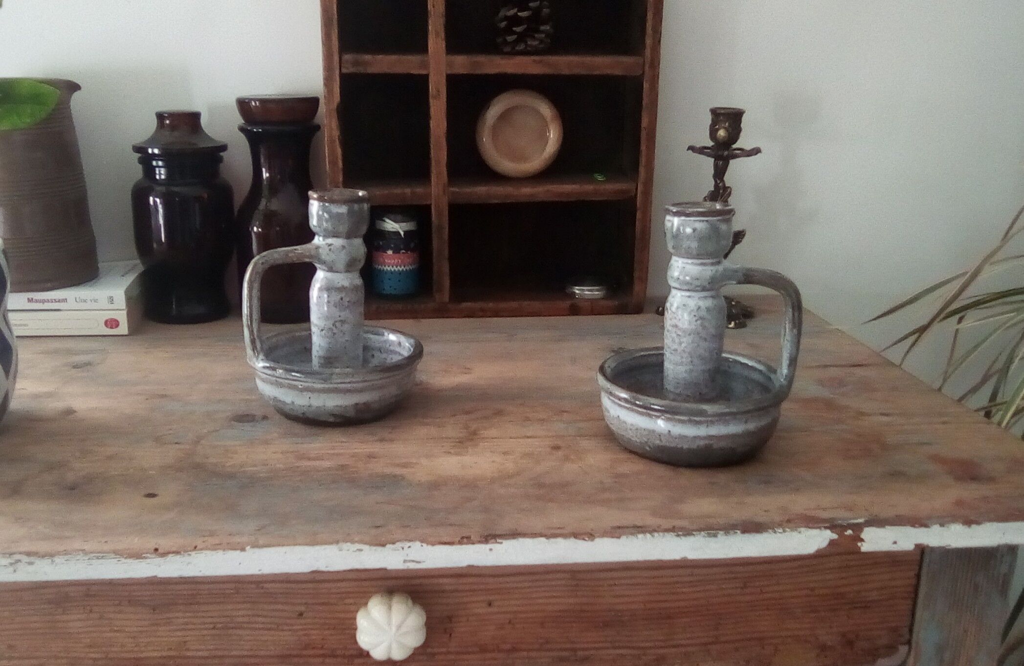 Pair of speckled sandstone candle holders
