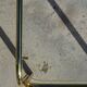Nested table in gold metal and glass