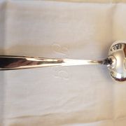 Silver cutlery set for 36 place settings and its ladle.