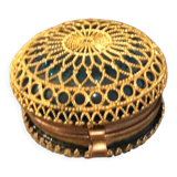 Old pill box made of golden thread