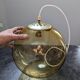 Old large and imposing thick glass globe with a bubbled amber colour, vintage.