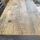Vintage wooden table with a cast iron base.