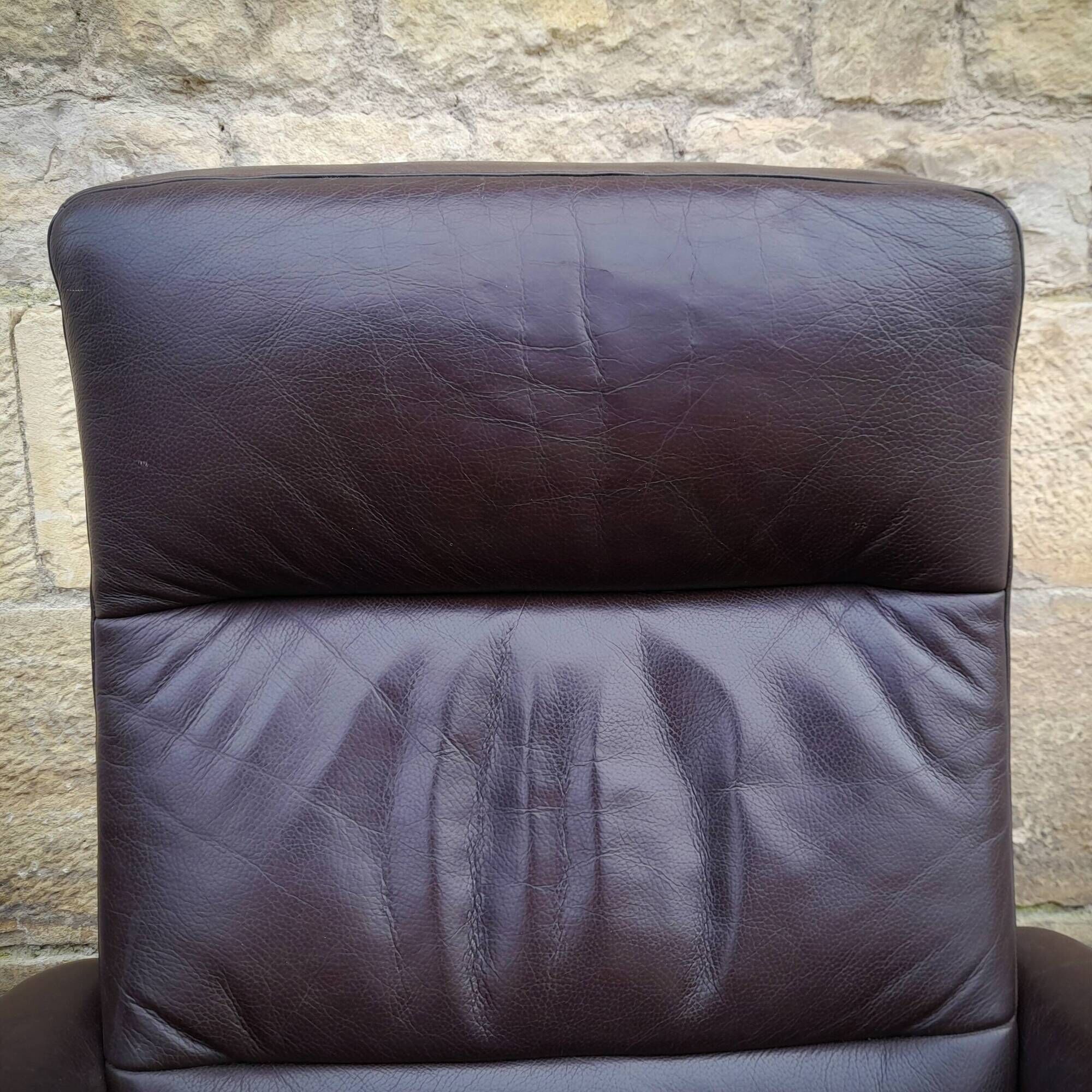 Pair of Scandinavian leather armchairs and ottoman, Ekornes, Norway, 1970