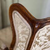 Pair of small Louis XV style wing chairs in carved walnut, Bosson stamp