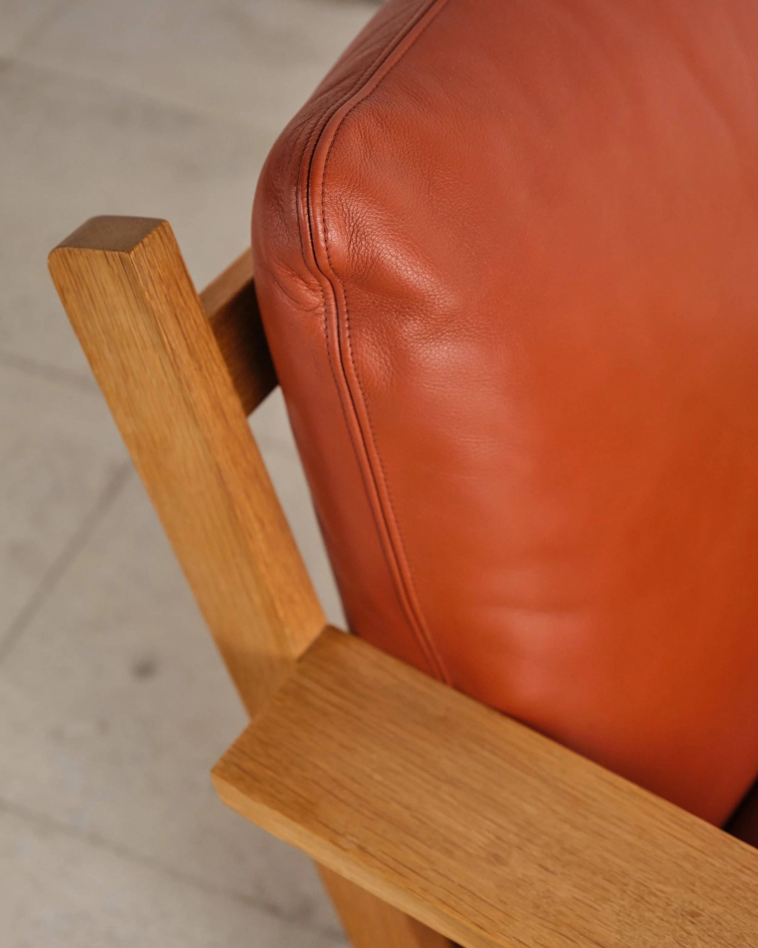Brutalist armchair and ottoman by Tage Poulsen, Denmark, 1970s.