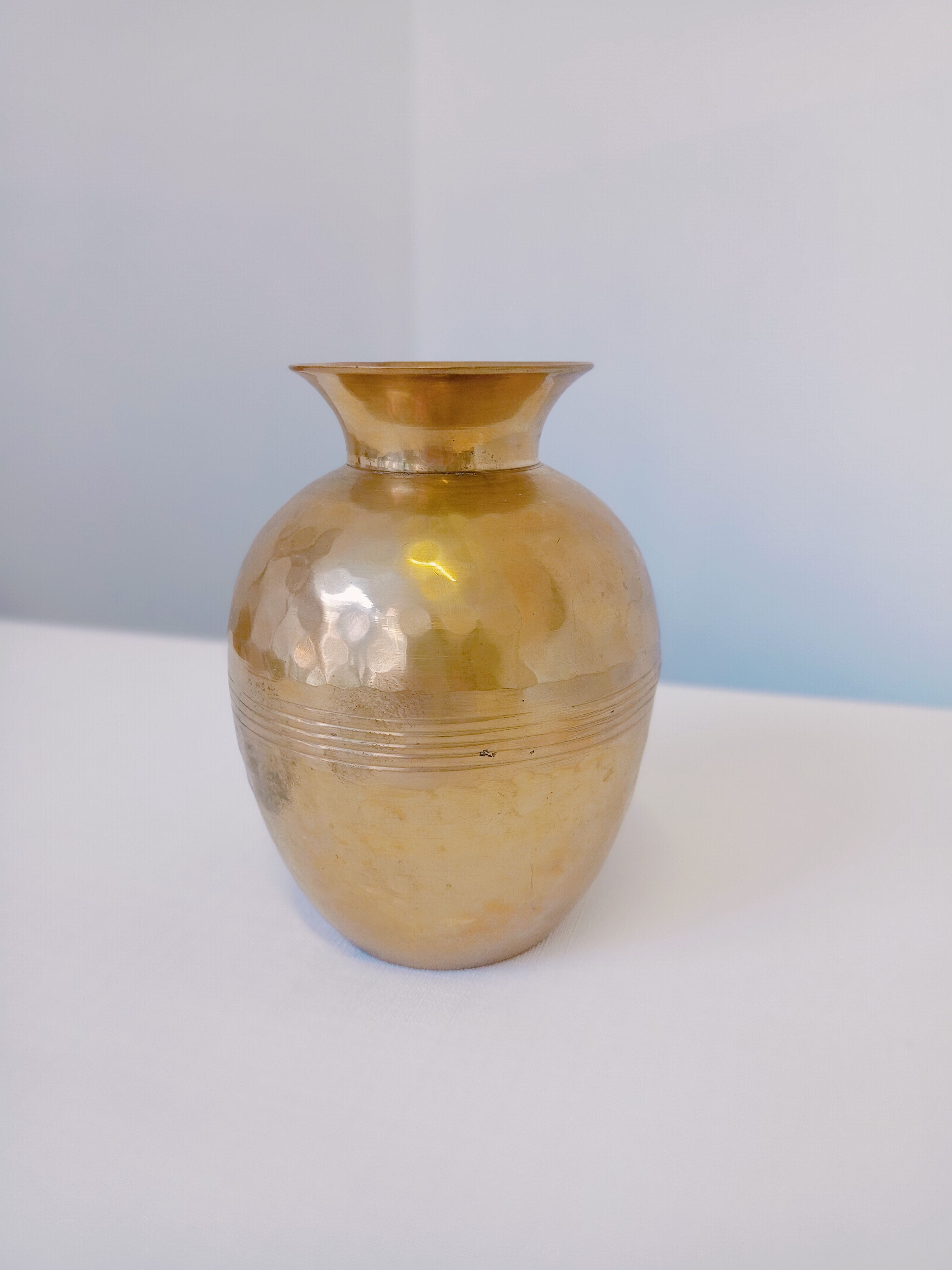 Hammered golden vase