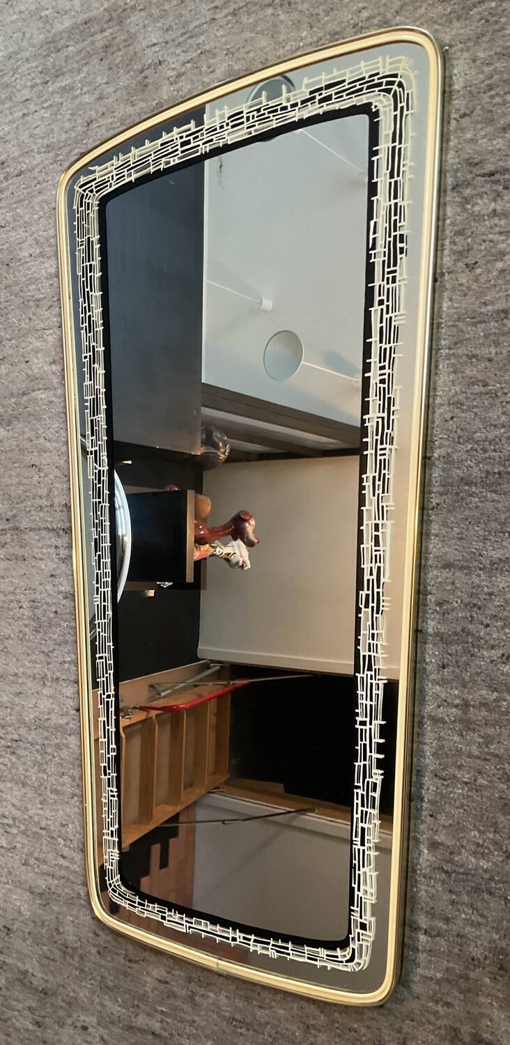 Asymmetrical free-form mirror from the 1970s