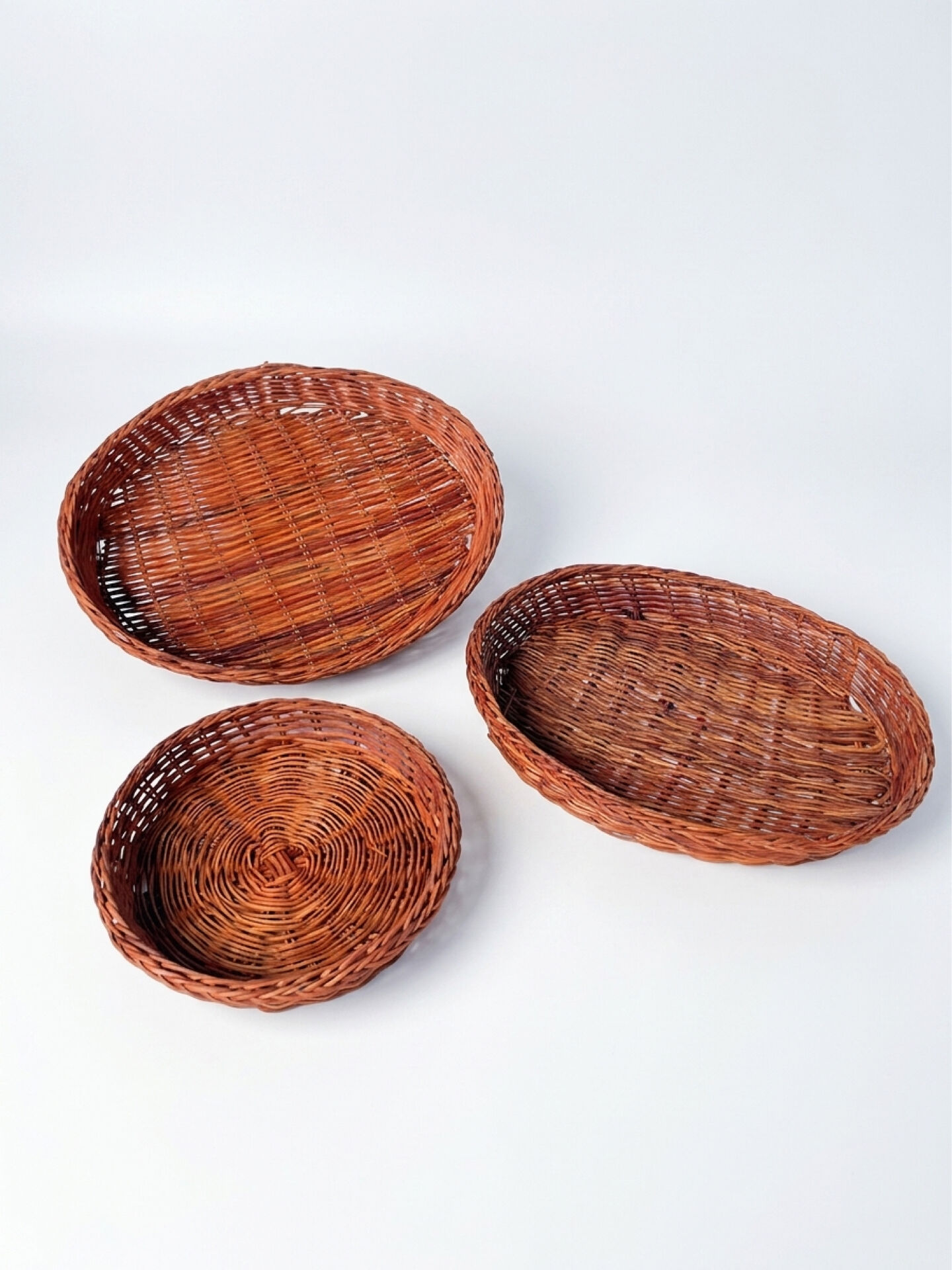 Set of 3 vintage ceramic dishes with wicker baskets.