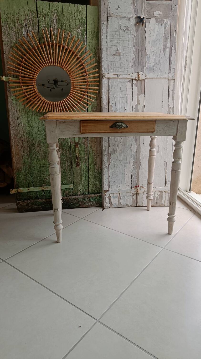 Antique wooden desk with a patinated base
