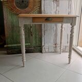 Antique wooden desk with a patinated base