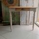 Antique wooden desk with a patinated base