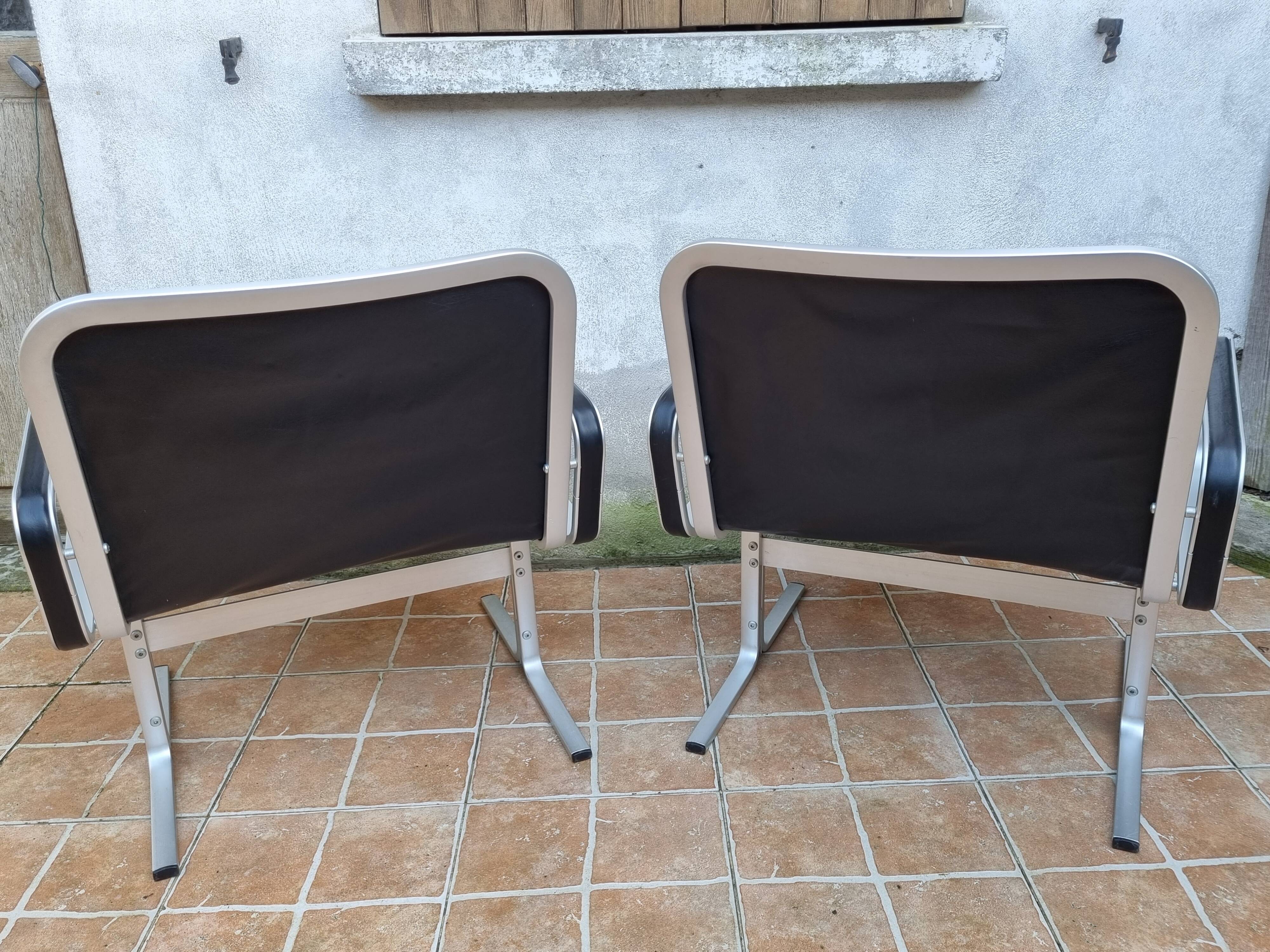 Pair of vintage leather and aluminum armchairs, restored