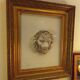 Antique large gilded frame with lion head ornament on plexiglass