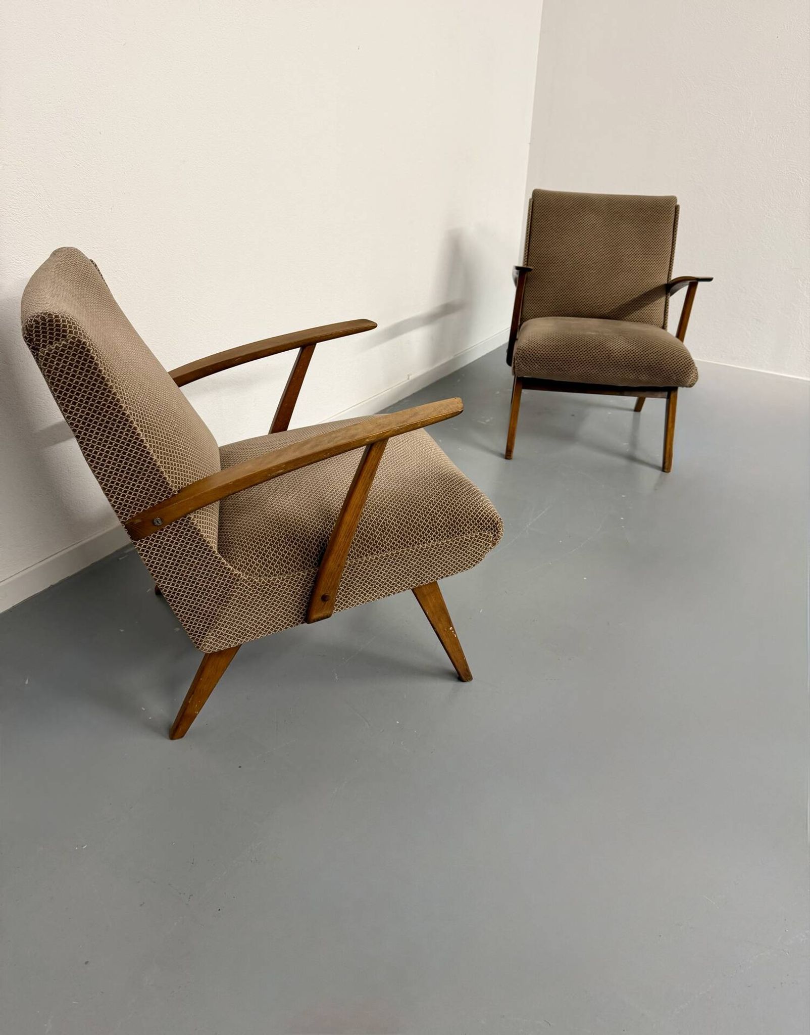 Set of 2 vintage wooden and fabric armchairs designed in the 1960s.