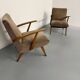 Set of 2 vintage wooden and fabric armchairs designed in the 1960s.