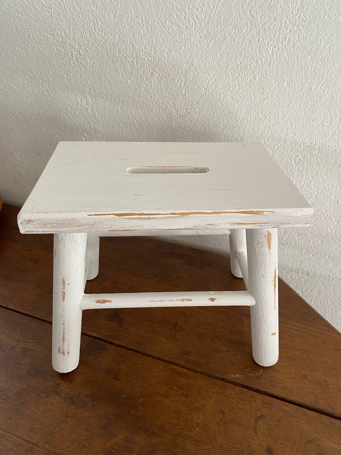 Small footrest bench in patinated white wood