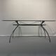 Table, bureau en aluminium brossé et verre formant "rognon" par Bernard Dequet