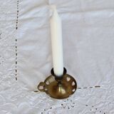 Antique brass rat trap with heart patterns.