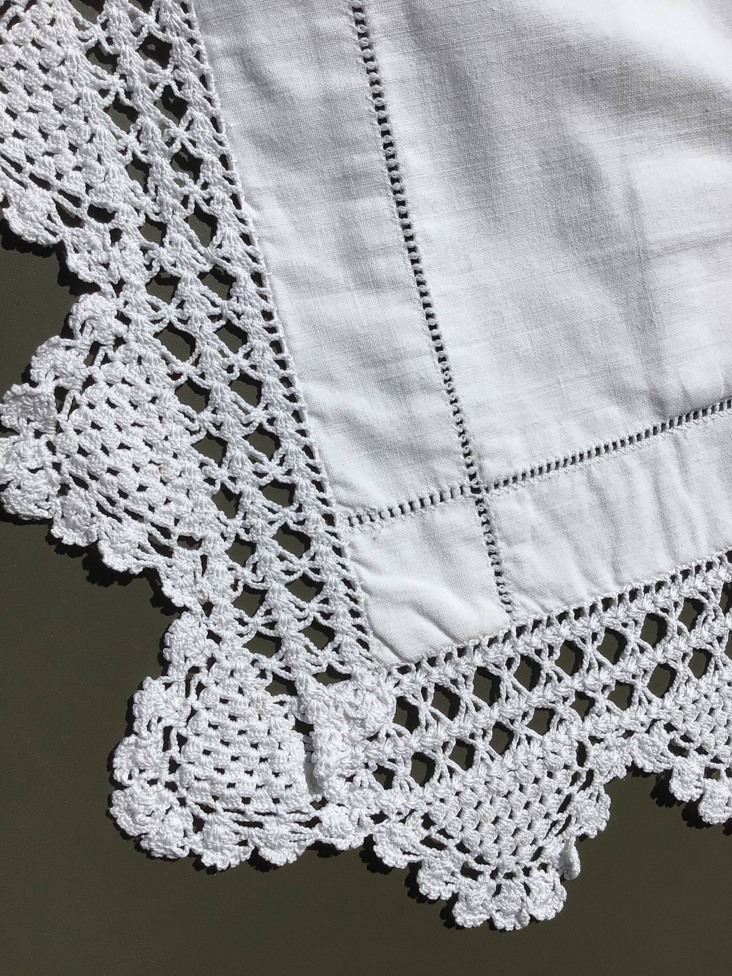 MC embroidered pillowcase with flower detailing and crocheted edge