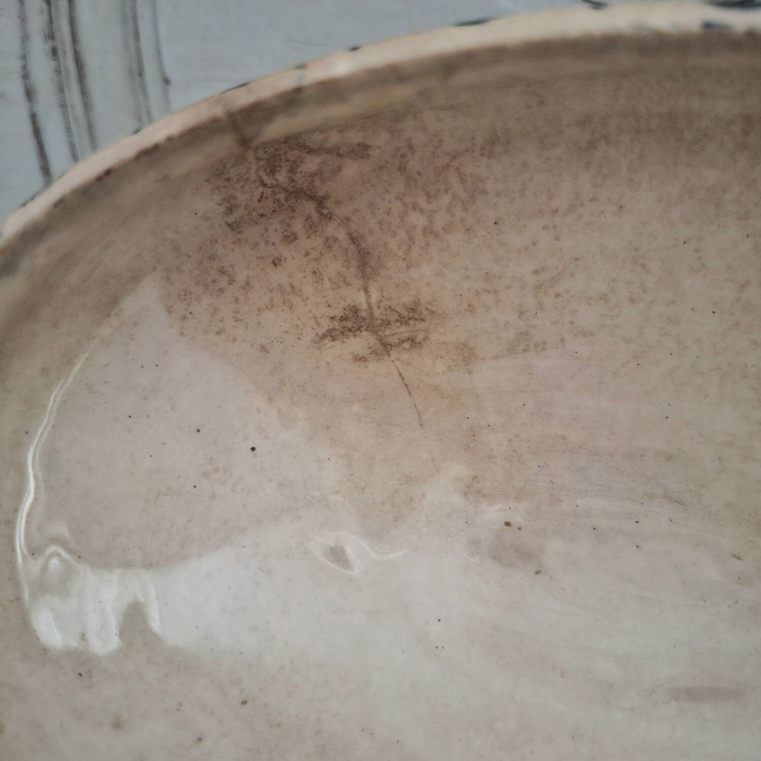 Antique iron earthenware sauceboat on a frame