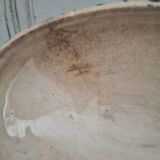 Old iron earthenware sauce boat on frame