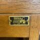 1950s oak office storage cabinet with curtains.