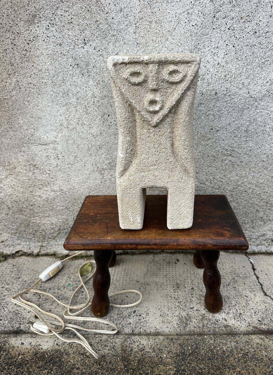Anthropomorphic stone table lamp brutalised by Albert Tormos.