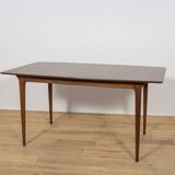 Extendable teak dining table in Mid-Century style from McIntosh, UK.