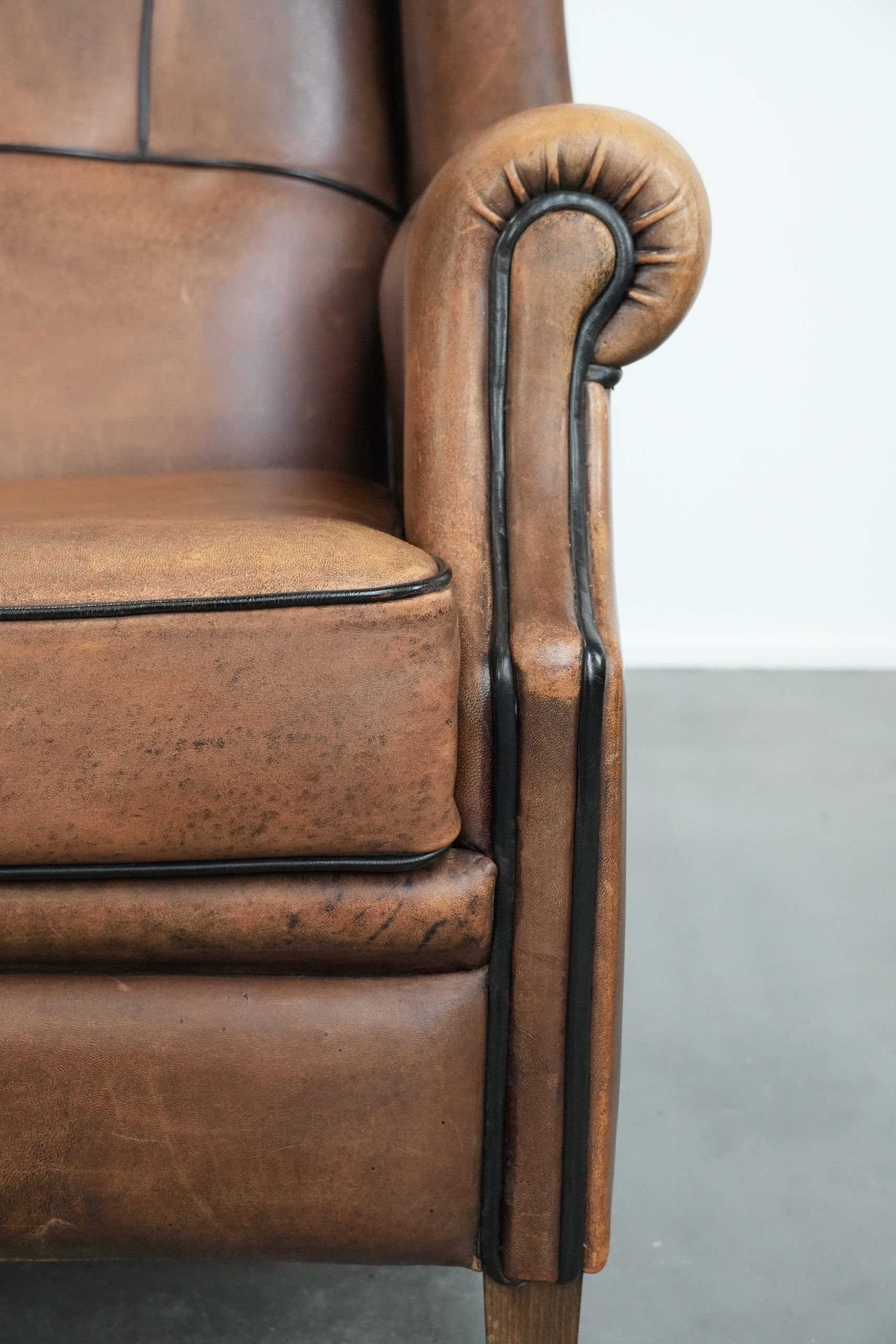 Sheepskin wingback armchair with beautiful colours in good condition