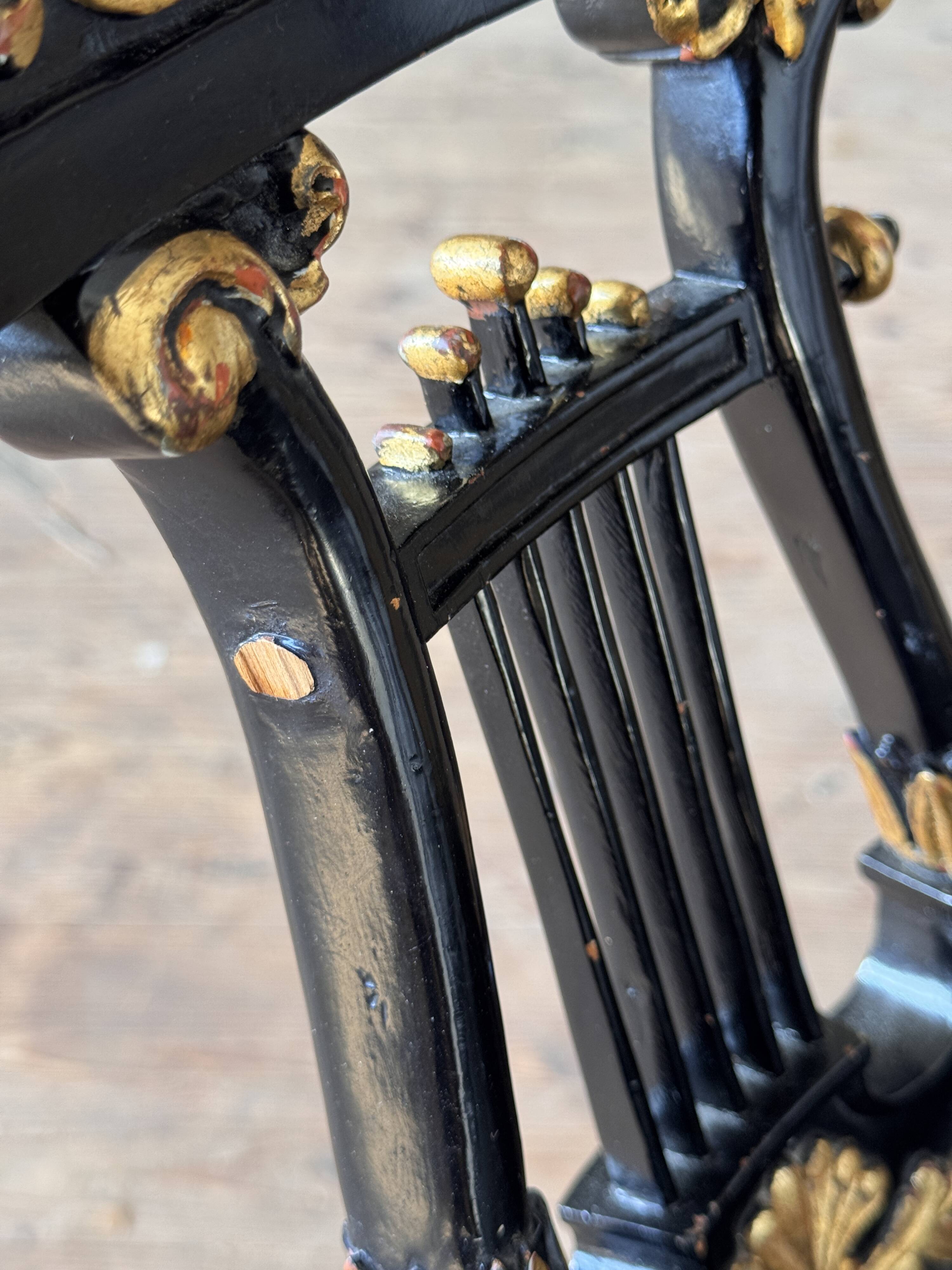 Pair of Empire-style bergère armchairs decorated with swans and lyres