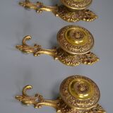 Three coat hooks with brass hook
