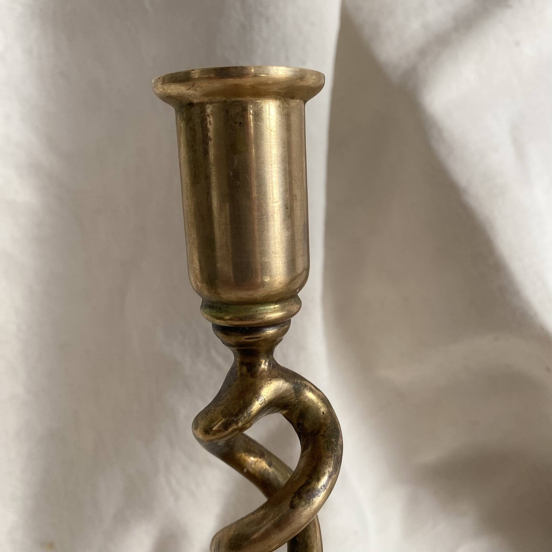 Pair of twisted brass candlesticks