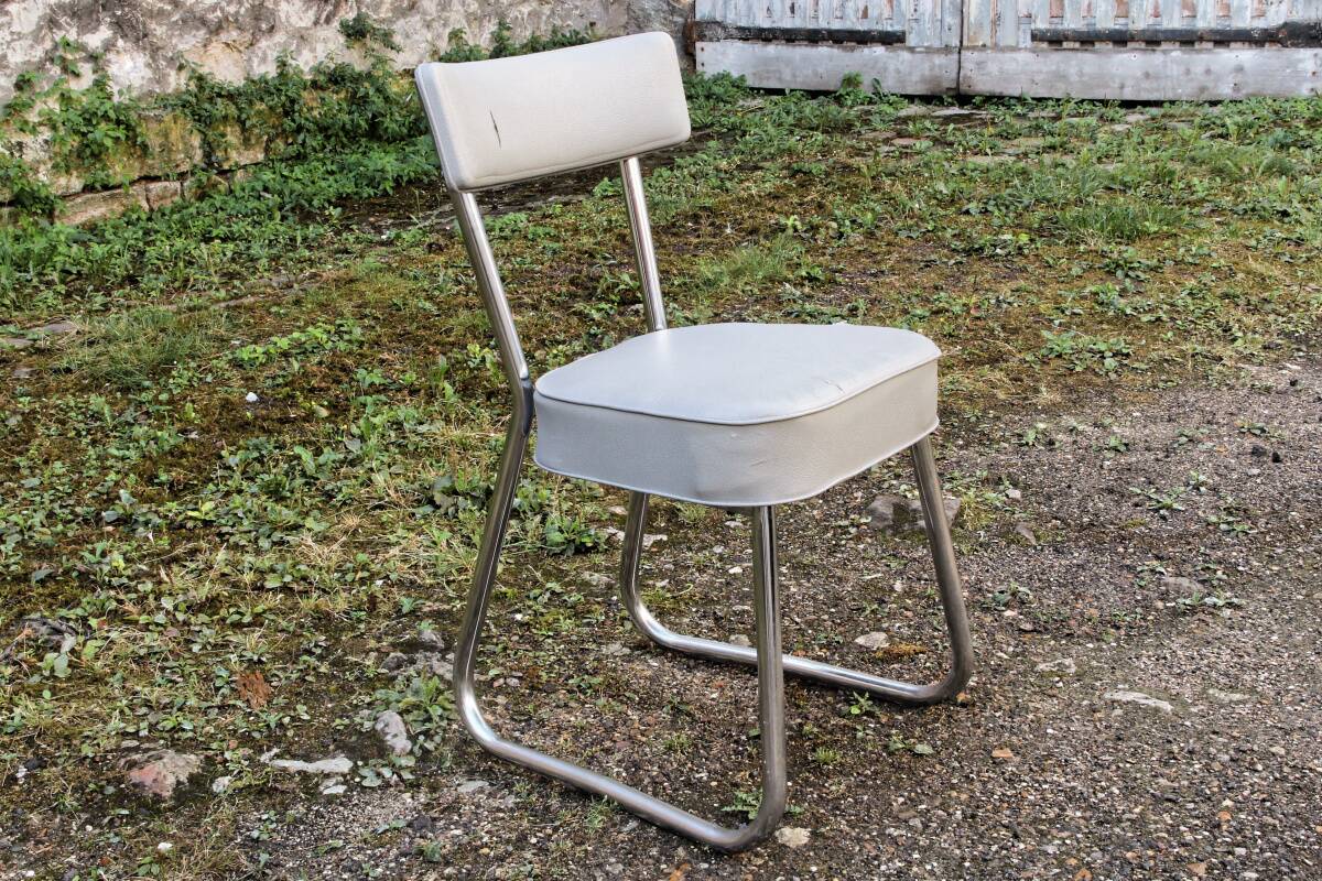 Set of 2 chairs and 1 armchair from the 70s in chrome metal and faux leather.