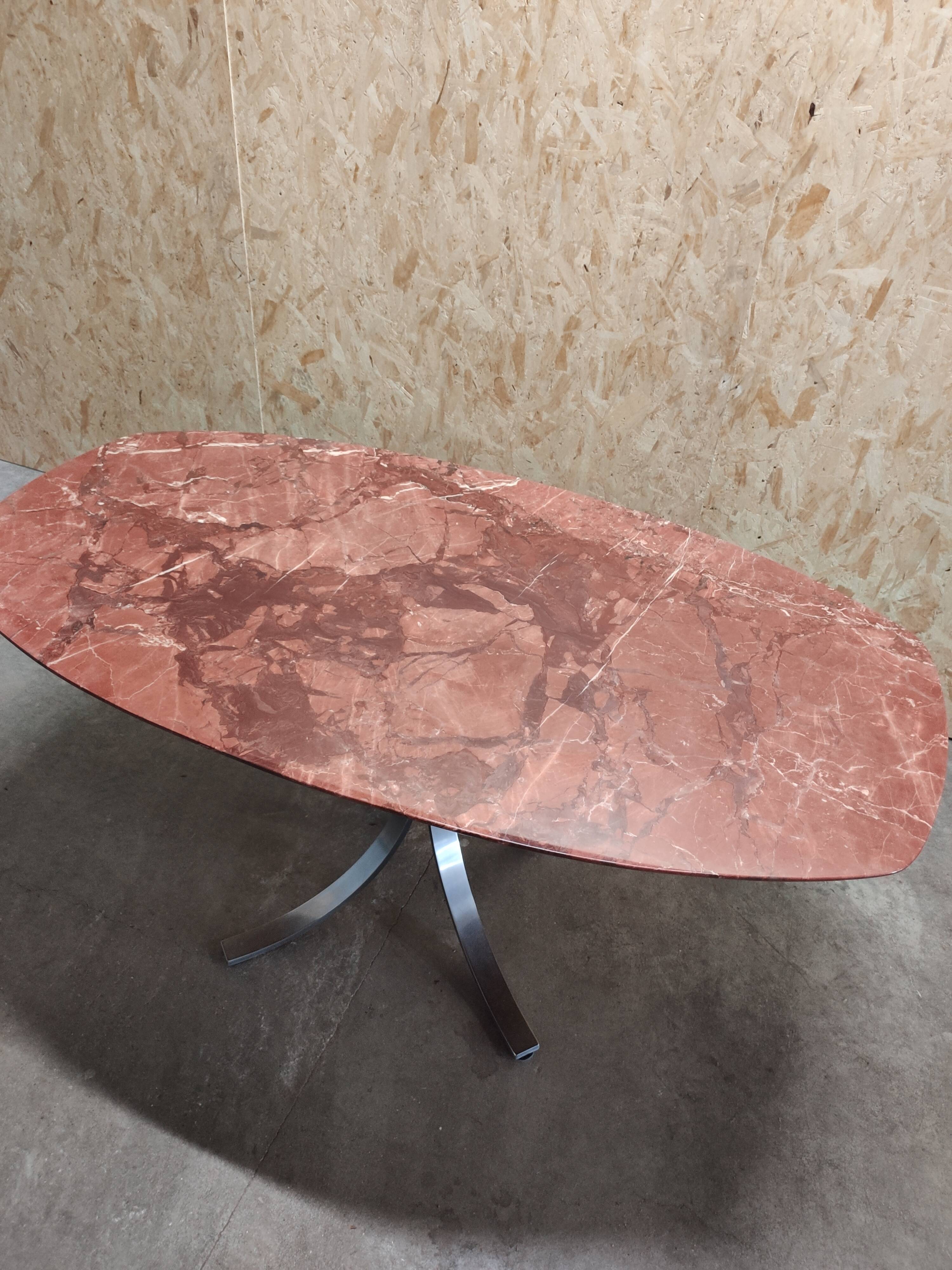 Oval dining table in red marble alicante techno
