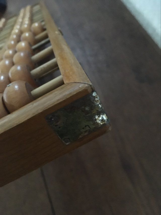Vintage abacus made of light wood.