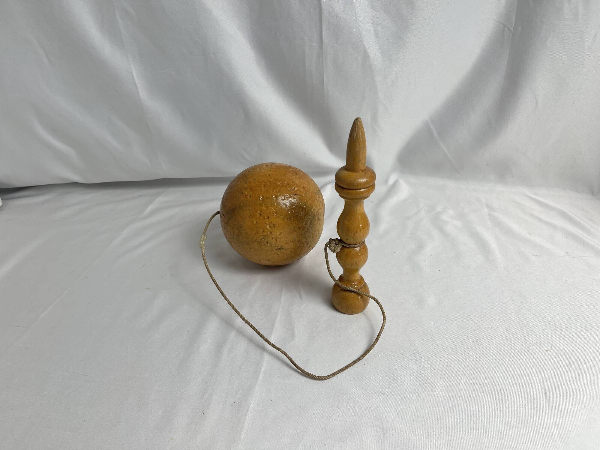 Old bilboquet toy in varnished wood 20th century