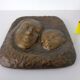 German bronze relief of mother with baby, 1940s.