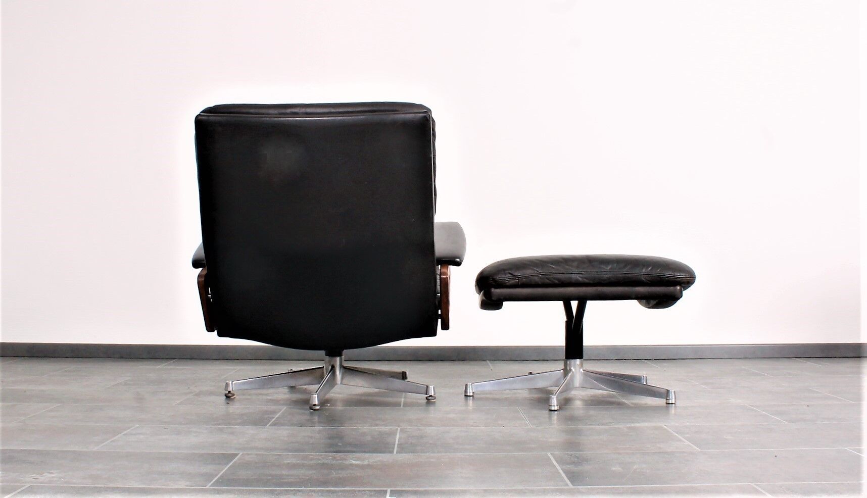 Armchair and footstool by André Vandenbeuck for Strässle in black leather