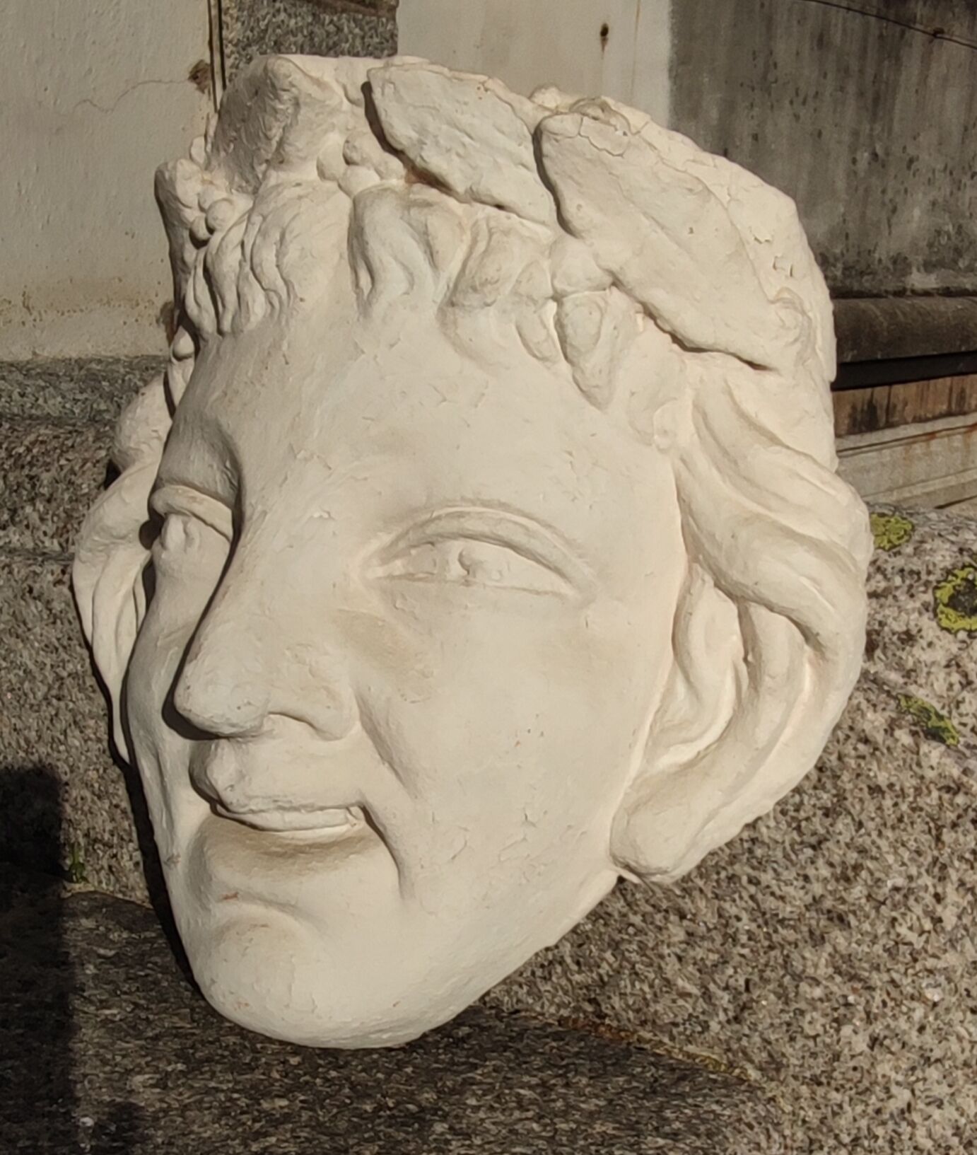 Old face in plaster antique decoration
