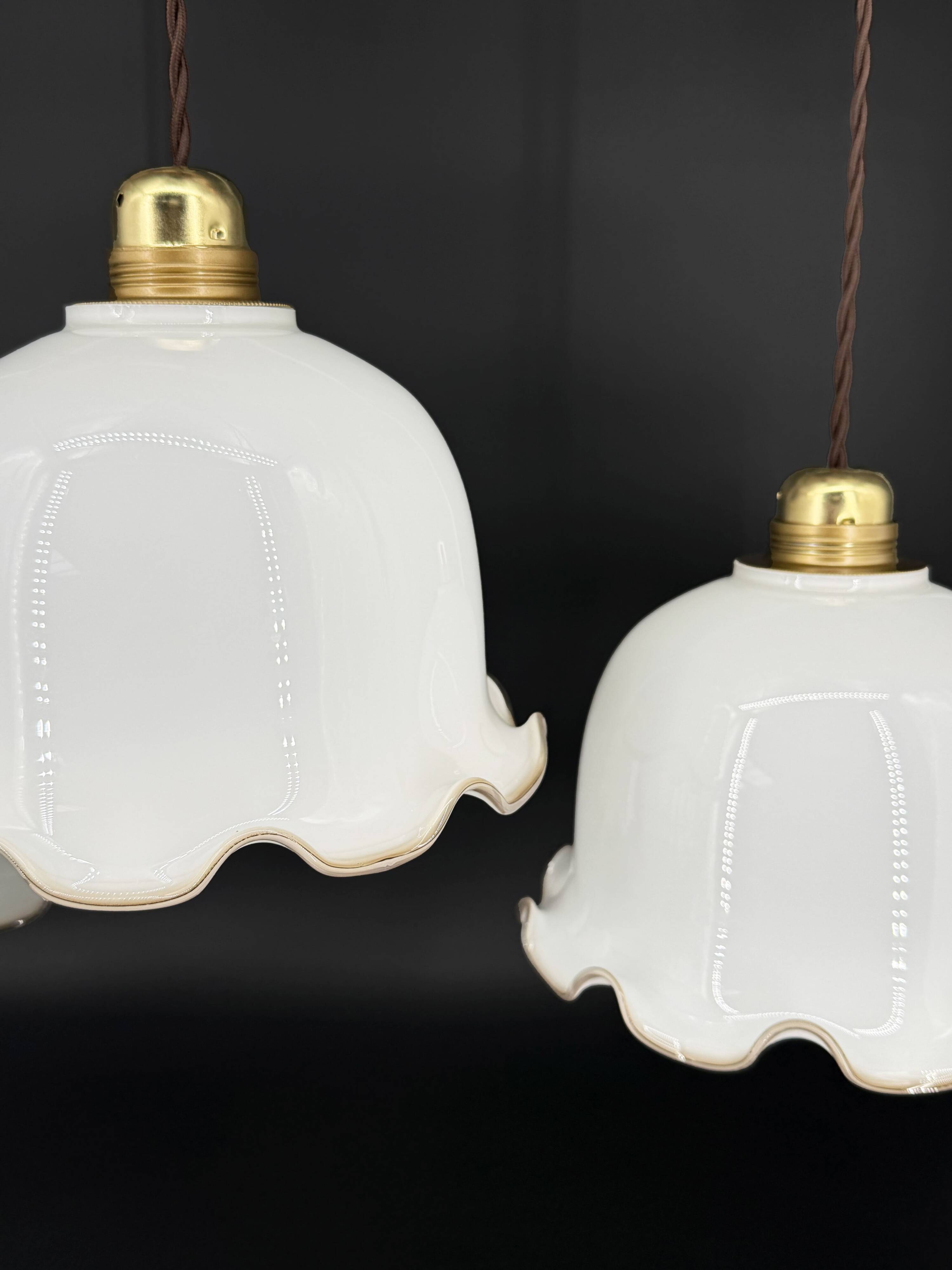 Set of 3 vintage bell-shaped pendants in white opaline with brown trim.