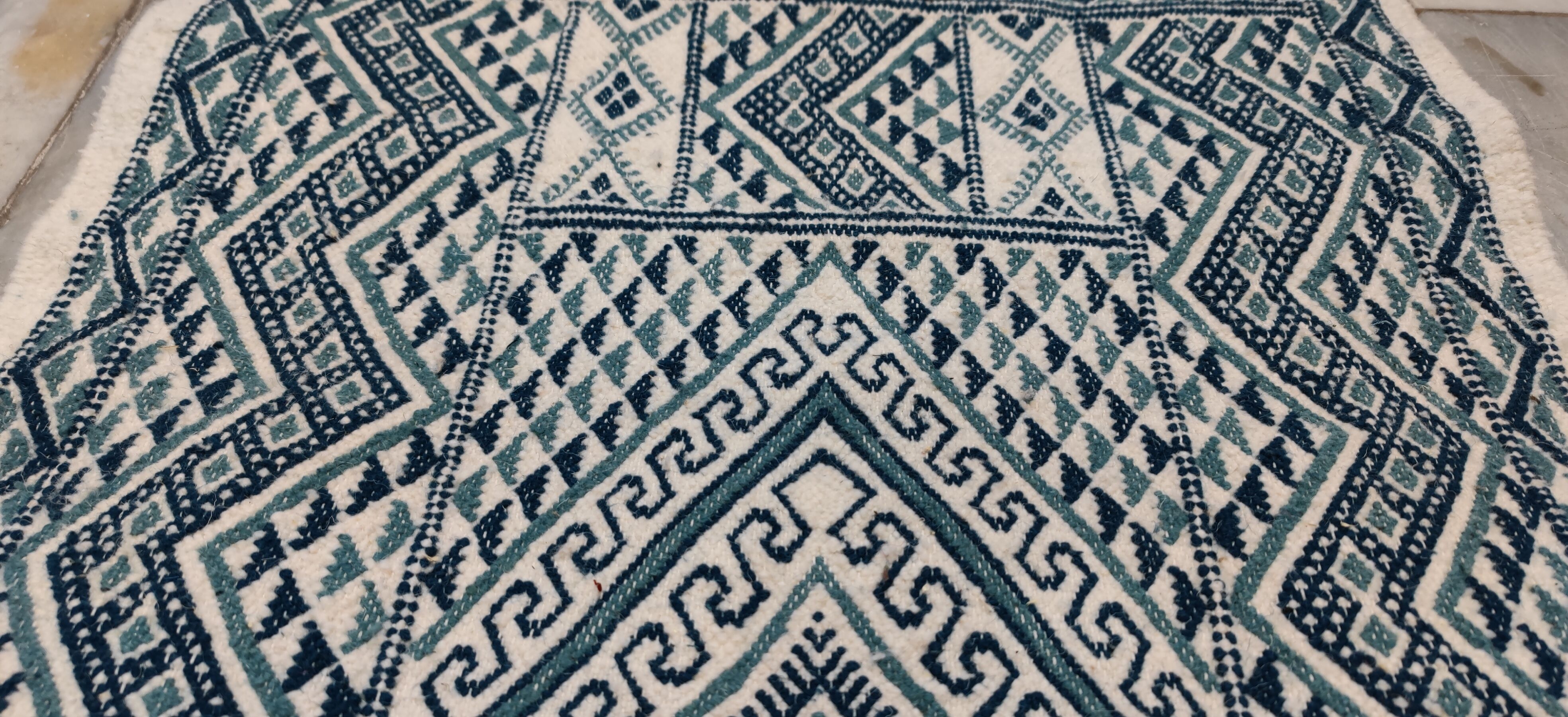 Handmade traditional white and blue carpet, 152x76 cm