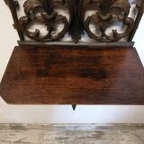 Carved wooden wall shelf