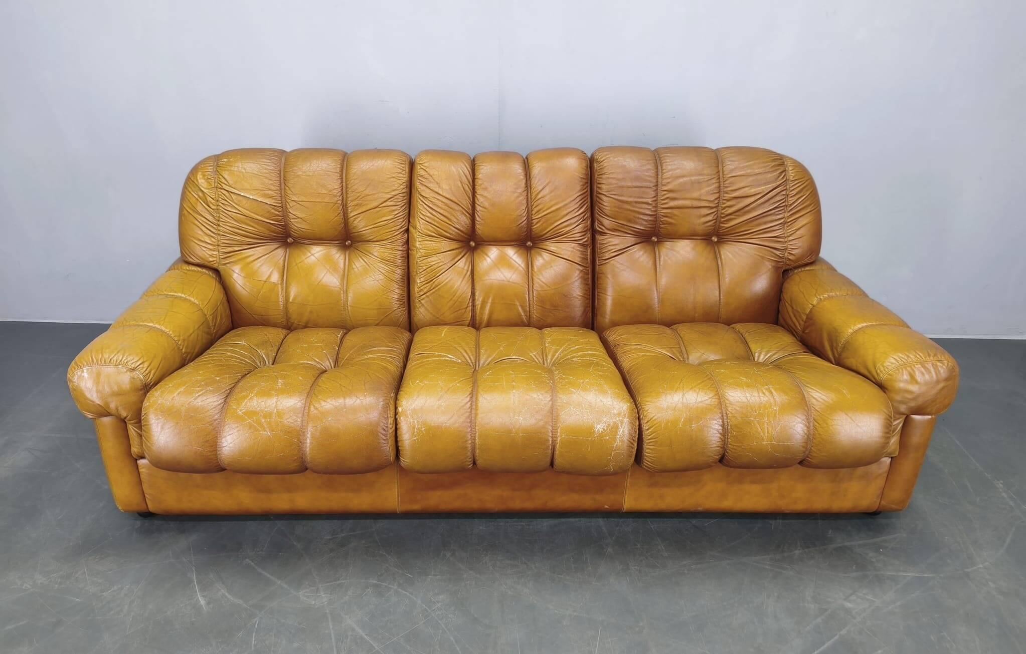 Three-seater sofa from the mid-century produced in Italy in the 1970s.