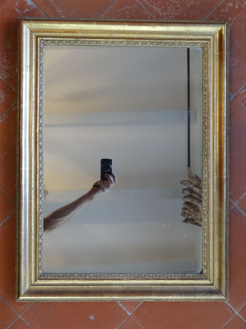 Empire period mirror, early nineteenth in gilded stucco wood H 72 cm